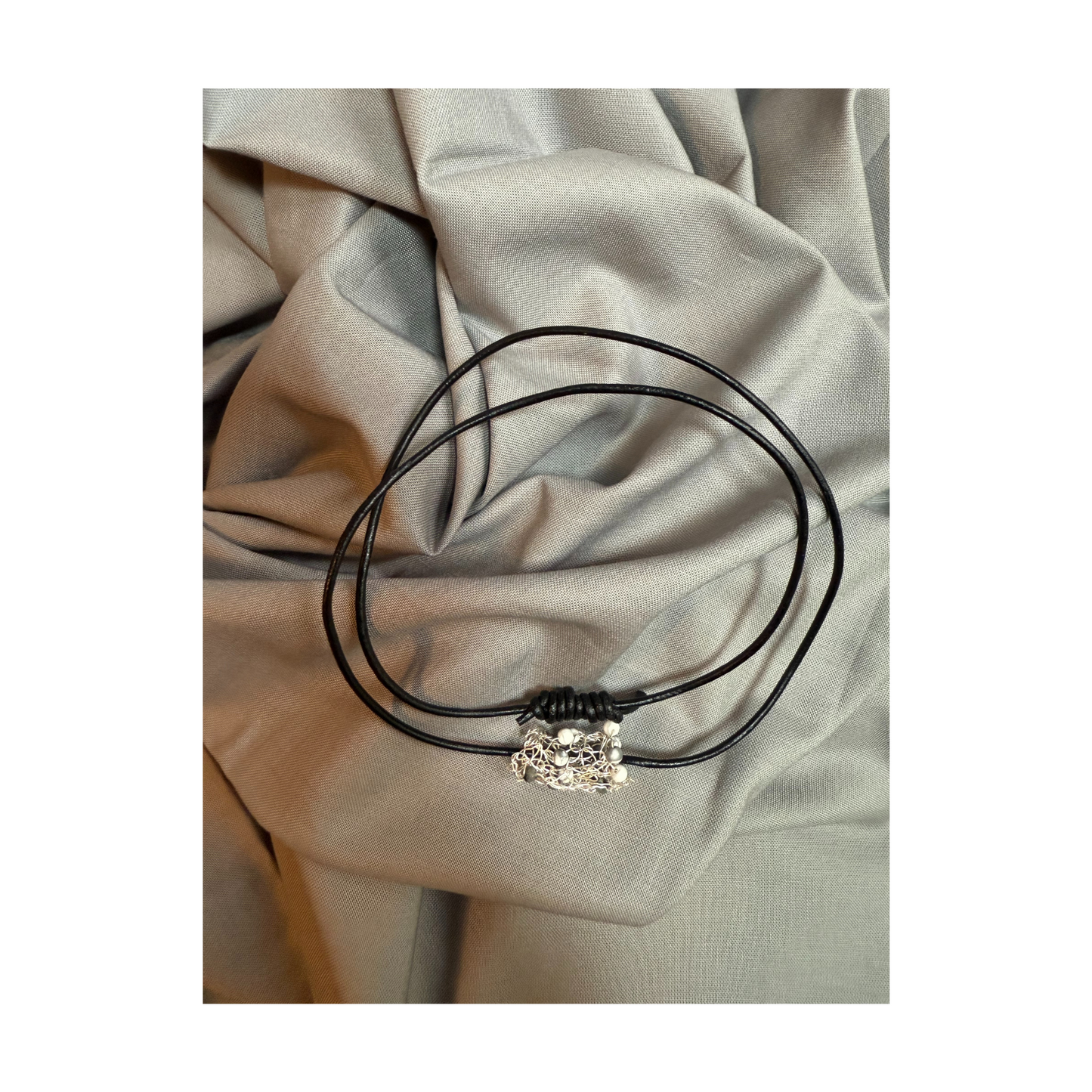 White Howlite & Black Labradorite Barrel Pendant by Larissa Gonzalez
